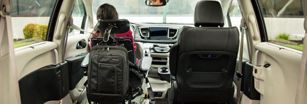 girl inside wheelchair van